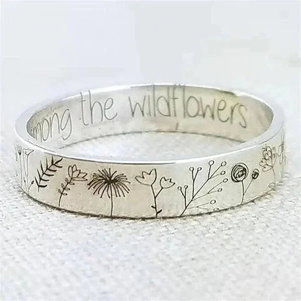 Zilveren ring met paardenbloemdesign