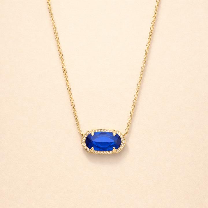 Elegante gouden ketting met ovale saffier