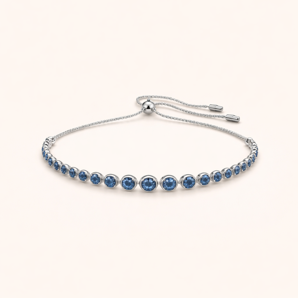 Elegante witgouden tennisarmband met geslepen saffier
