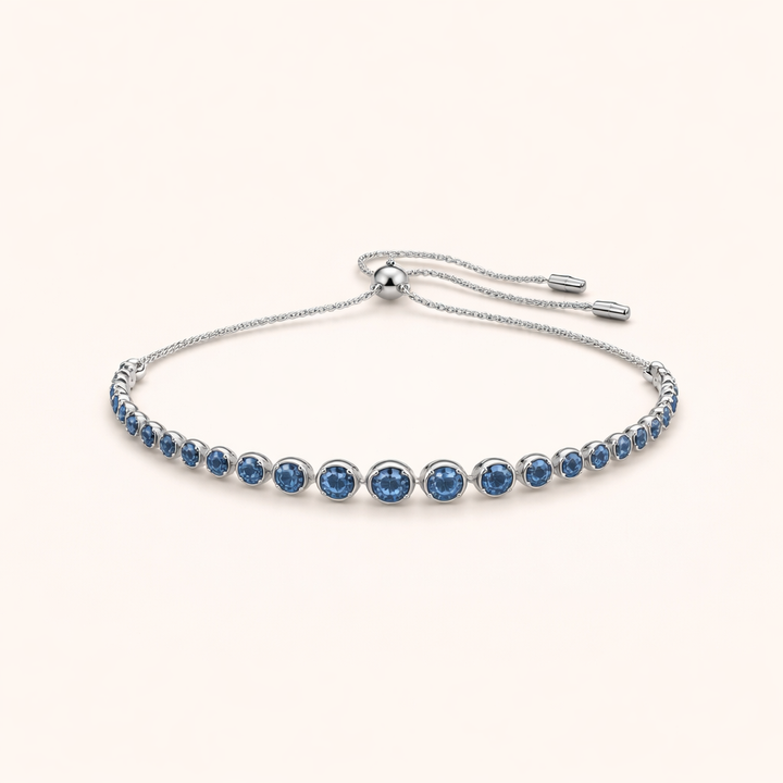 Elegante witgouden tennisarmband met geslepen saffier