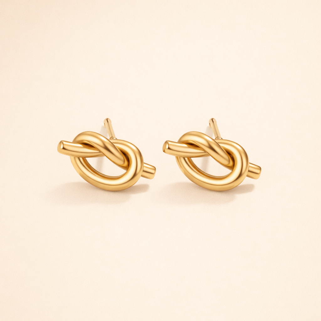 Elegante zilveren oorbellen met verfijnde knoopdetails