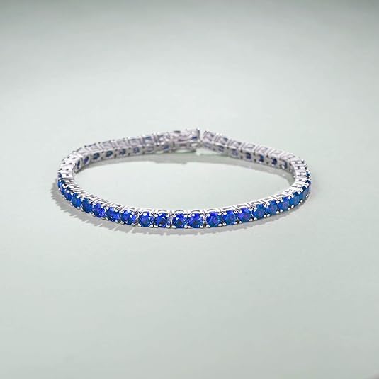 Elegante witgouden tennisarmband met saffieren details