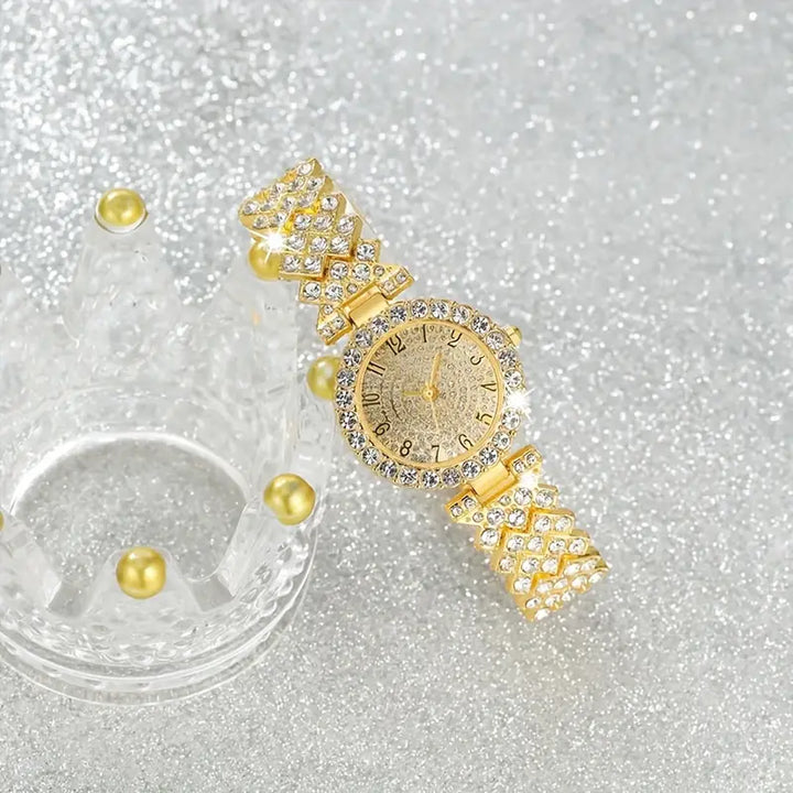 Elegante gouden horloge met subtiele schakelstructuur
