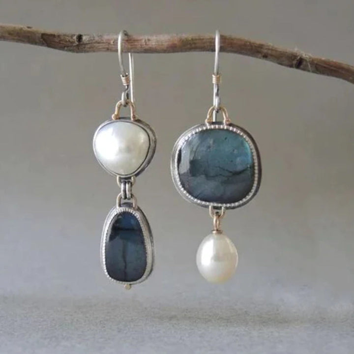 Elegante oorbellen met blauwe steen en parel