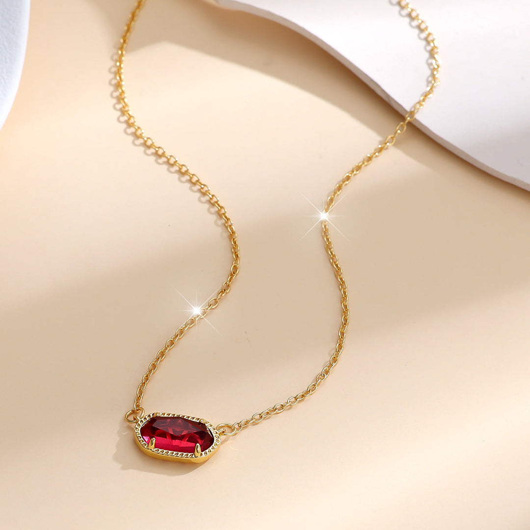 Elegante gouden ketting met ovale robijn