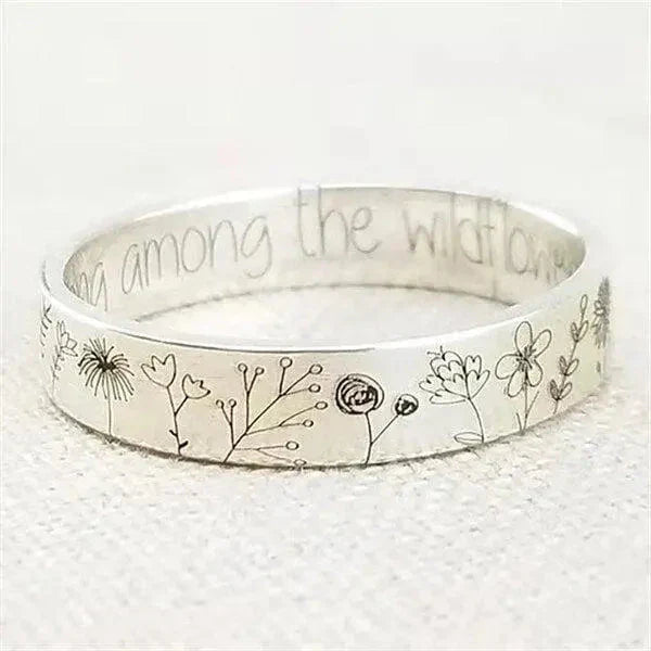 Zilveren ring met paardenbloemdesign