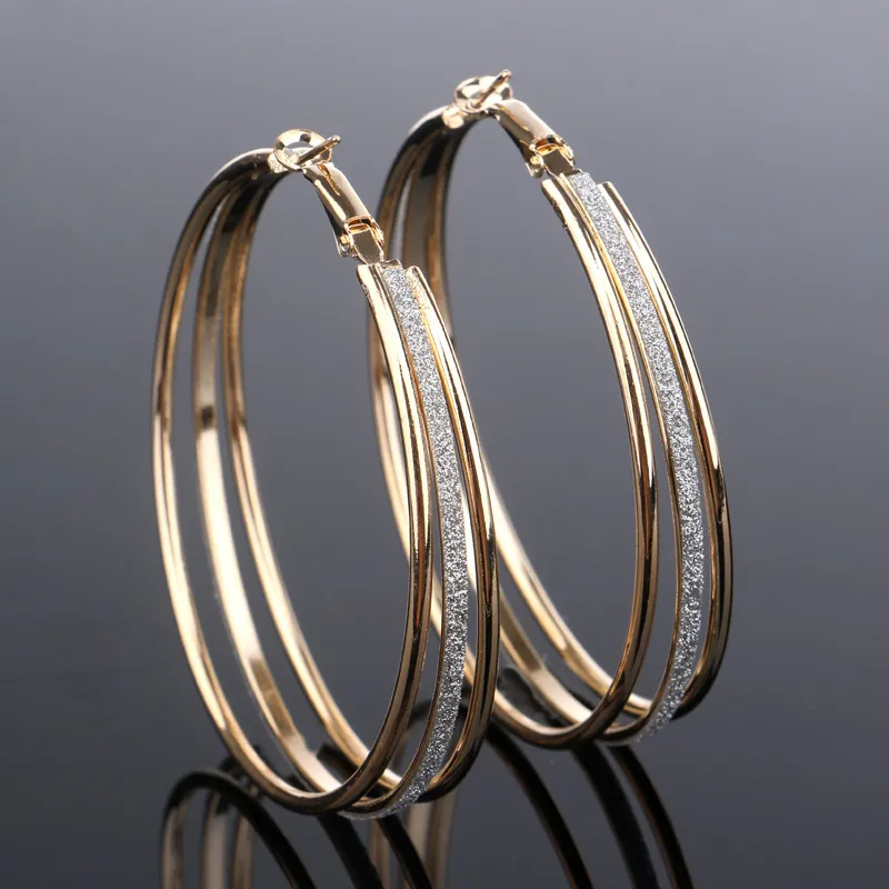 Glanzende vintage gouden oorbellen
